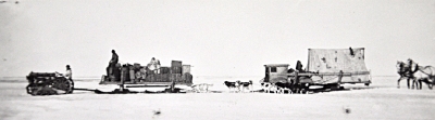 Tractor train making its way on the frozen river