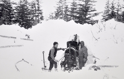 Snowmobile stuck and buried in deep snow